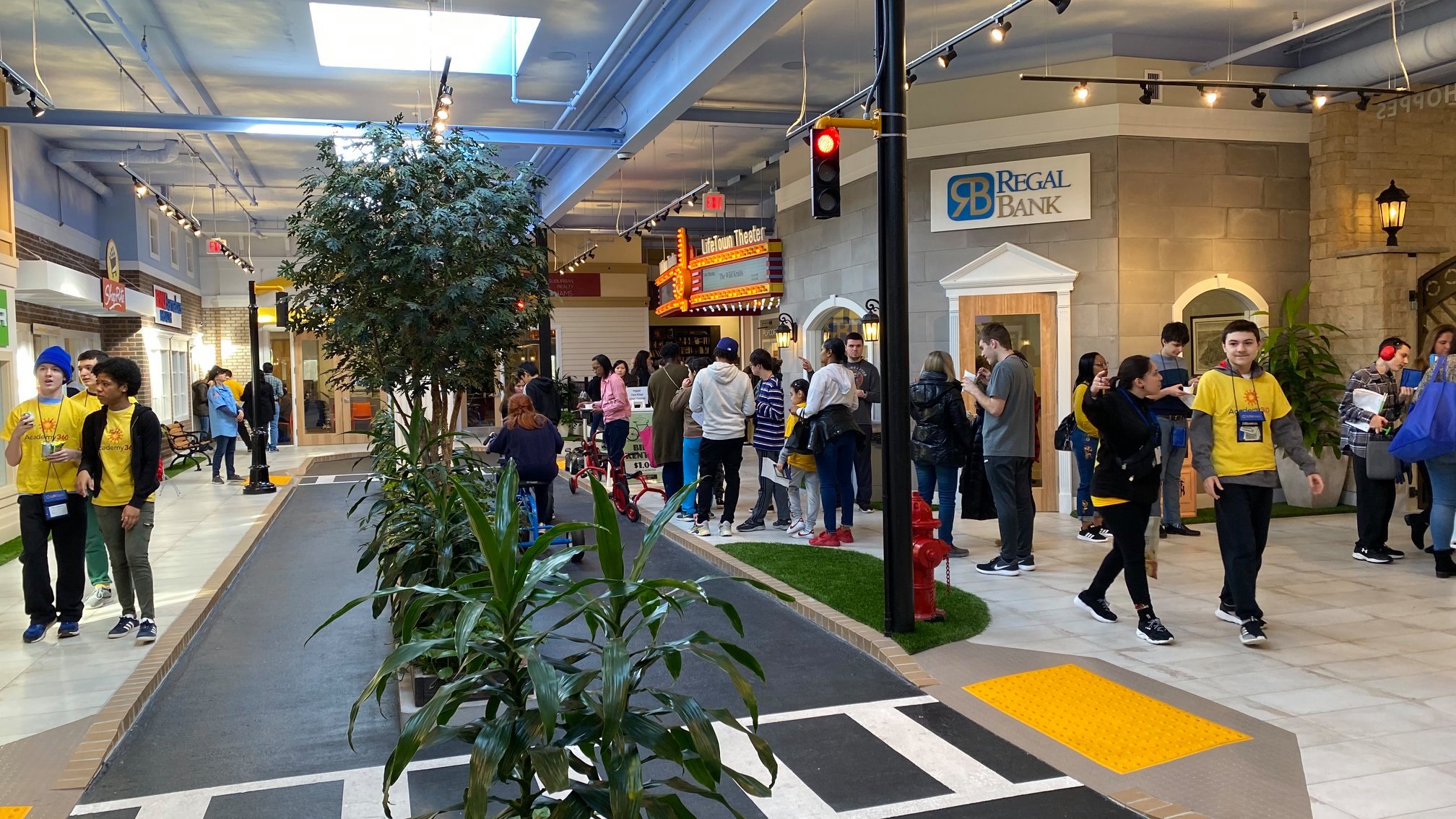 Students exploring LifeTown Shoppes, a simulated city with real stores